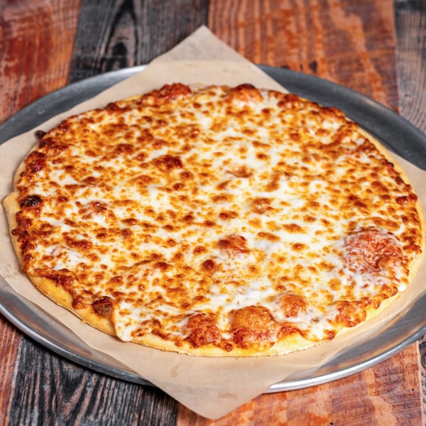 A whole cheese pizza with melted, golden-brown cheese on a metal tray with parchment paper.
